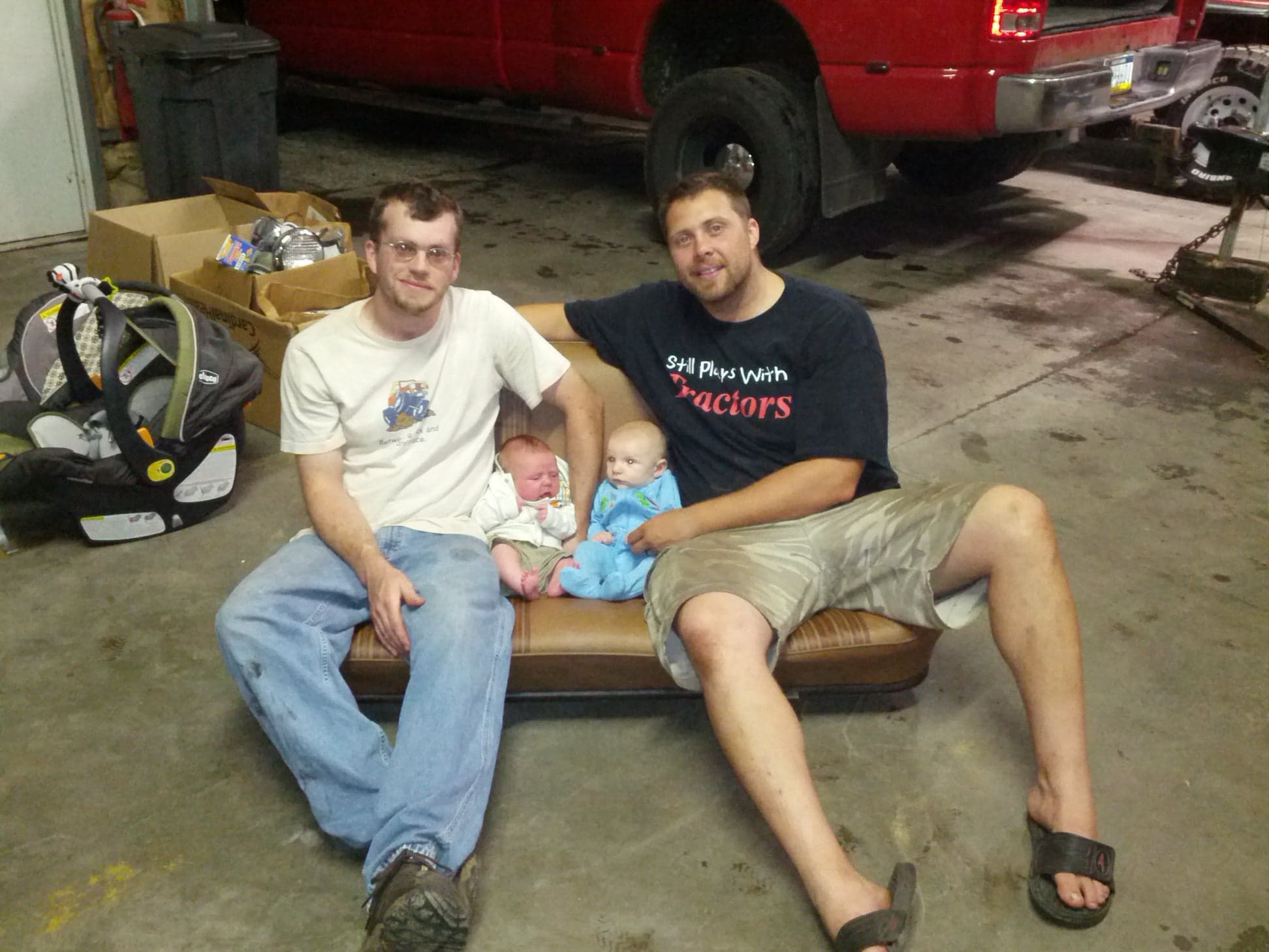 Pic of Scott and Aiden Brown, and Leo and Neil Simpson seated on Jeep bench seat.
